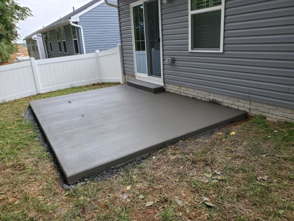 Concrete patio with concrete step